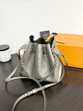 Load image into Gallery viewer, LOUIS VUITTON 2023 Bella Mahina Leather Bucket Bag in Gray Metallic